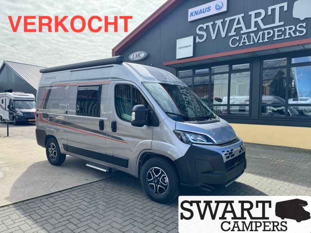 WEINSBERG-CARABUS-540-MQ-EDITION-FIRE-1-Medium - Swart Campers Sold grey camper van at Swart Campers dealership, with a bold red VERKOCHT sign and Swart Campers building visible in the background.