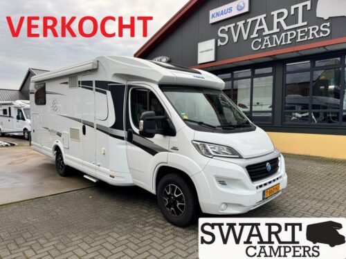 KNAUS SKY TI 700 MEG SILVER SELECTION - Swart Campers White motorhome parked outside Swart Campers with a red VERKOCHT banner overhead, dealership building in the background.