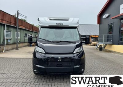 Front view of a black KNAUS camper van in an outdoor lot with Swart Campers watermark bottom-right.