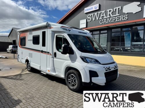 WEINSBERG CARACOMPACT 600 MF EDITION PEPPER - Swart Campers White motorhome parked outside a Swart Campers dealership, with a large sign and windowed showroom in the background.