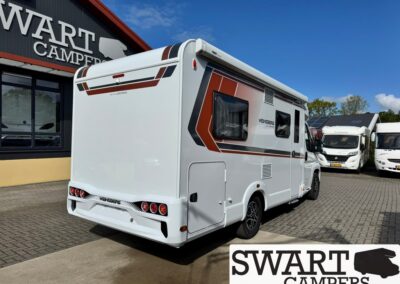 White motorhome with red-brown stripes parked outside a Swart Campers dealership on a sunny day in front of a blue sky.
