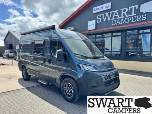 Weinsberg CaraBus Grey 540 MQ Edition FIRE - Swart Campers Grey camper van parked outside a Swart Campers showroom, with KNAUS signage visible on the building.