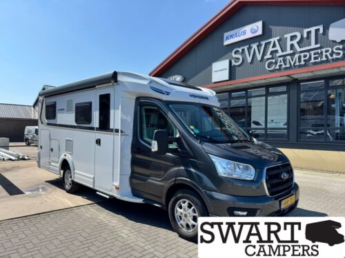WEINSBERG CARALOFT 650 MEG - Swart Campers White and black motorhome parked outside a Swart Campers showroom with a large 'SWART CAMPERS' sign above and a Ford front cab.