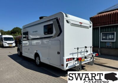 Rear/side view of a white motorhome with gray stripe decals parked in a lot; SWART CAMPERS watermark appears in bottom right.