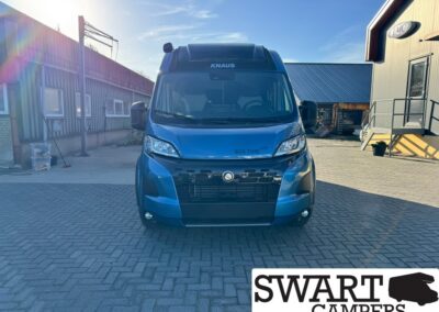Front view of a blue Knaus camper van in a paved lot, with 'BOX TIME' on the hood and a SWART CAMPERS logo in the corner.