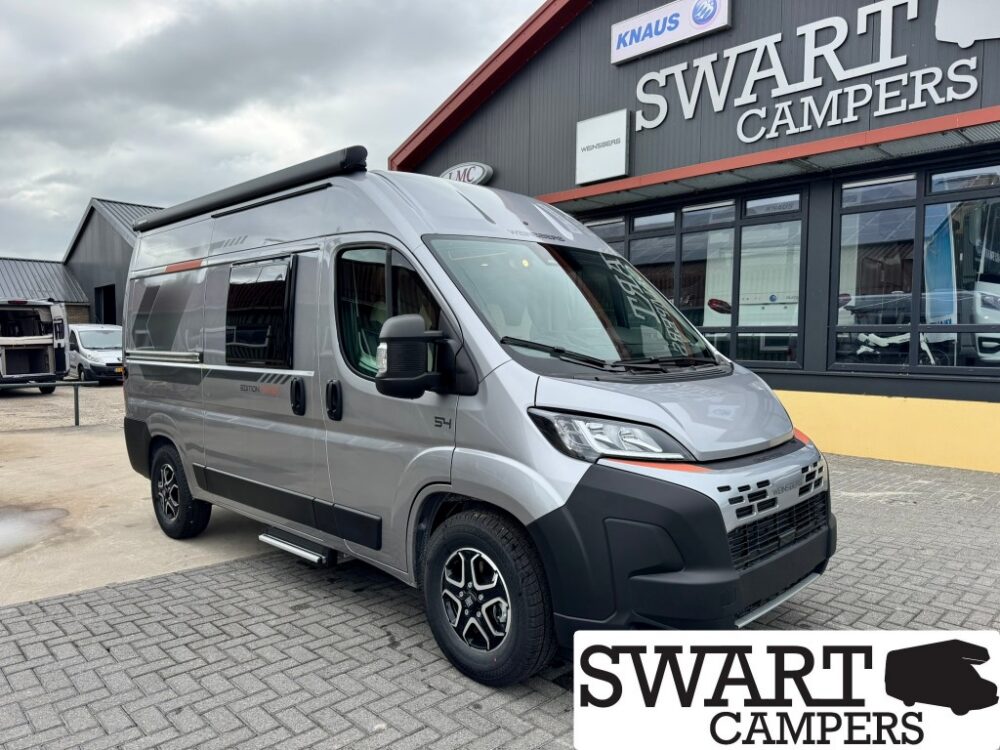 WEINSBERG CARABUS 540 MQ EDITION FIRE - Swart Campers Silver high-roof camper van parked outside Swart Campers showroom.