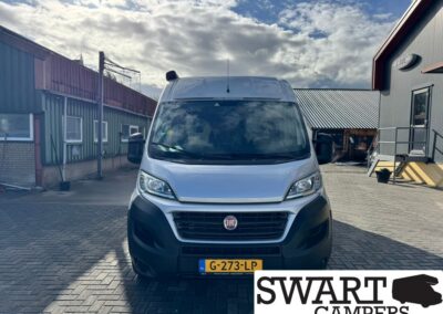 Front view of a white Fiat camper van parked in an industrial yard, license plate G-273-LP, with Swart Campers logo overlay in the corner.
