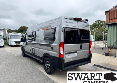 Rear and side view of a silver/grey Weinsberg camper van parked in a dealership lot with other motorhomes nearby, SWART CAMPERS logo bottom right.