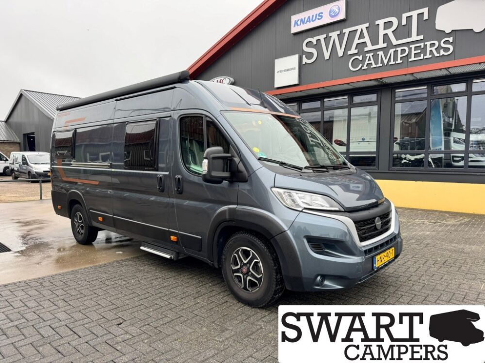 WEINSBERG CARABUS 630 ME - Swart Campers Dark gray camper van parked in front of a Swart Campers storefront, side view with roof awning extended